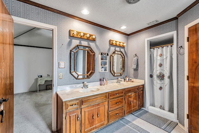 bathroom with ornamental molding, a sink, a textured ceiling, and wallpapered walls