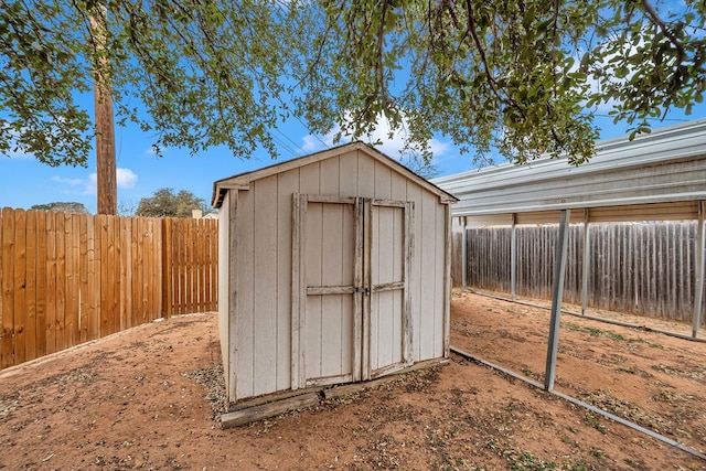 view of shed with a fenced backyard