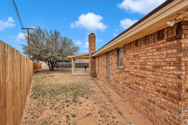 view of yard featuring a patio area and a fenced backyard