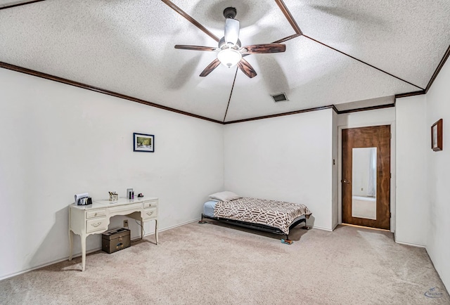 bedroom with a textured ceiling, ceiling fan, light colored carpet, visible vents, and ornamental molding