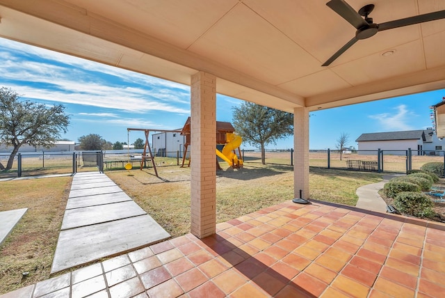 view of patio featuring a playground and ceiling fan