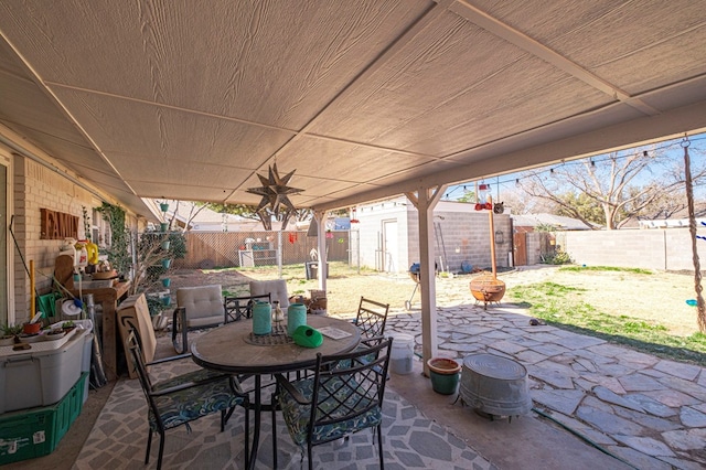 view of patio with a storage unit