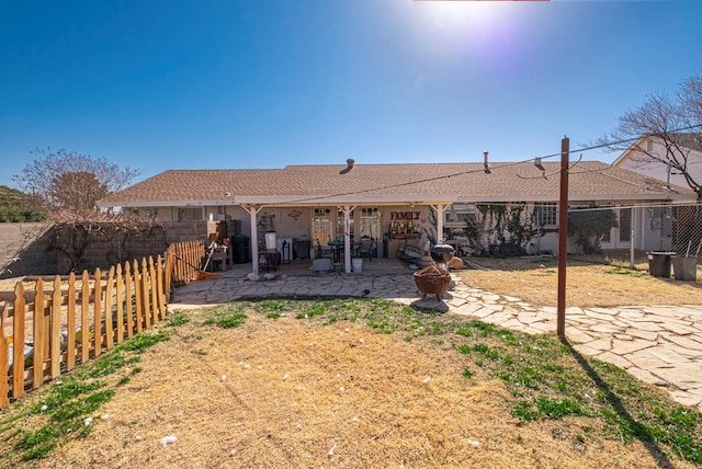 back of house with a patio area