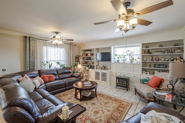 living room with ceiling fan, light tile patterned floors, ornamental molding, and a healthy amount of sunlight