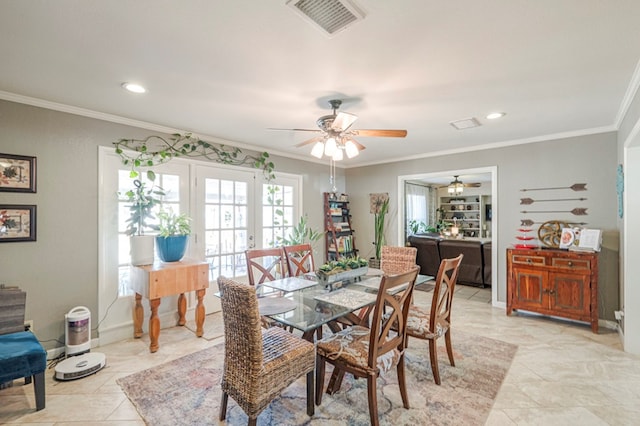 dining space with light tile patterned flooring, ceiling fan, and ornamental molding