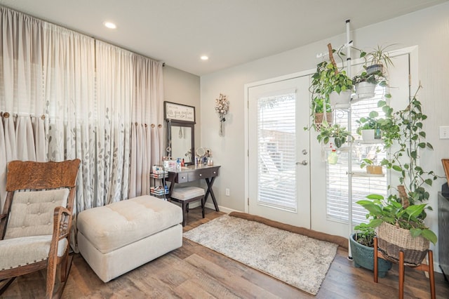 sitting room with hardwood / wood-style flooring