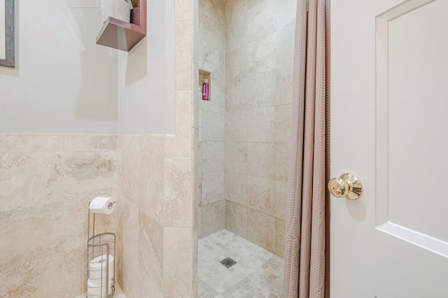 bathroom with a tile shower