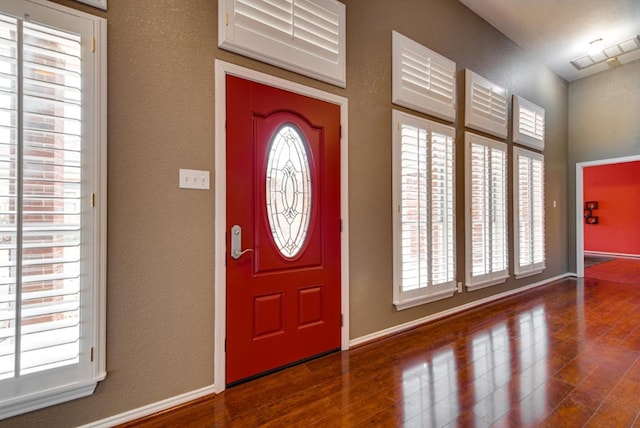 entryway with hardwood / wood-style floors