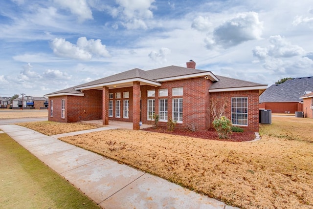 ranch-style house featuring central air condition unit