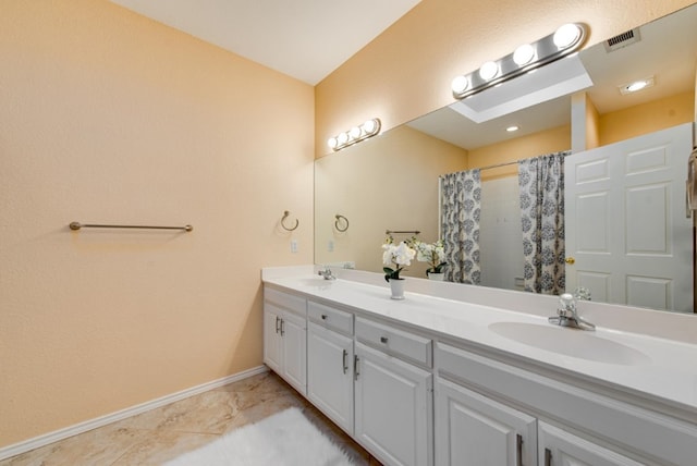 bathroom with vanity and walk in shower