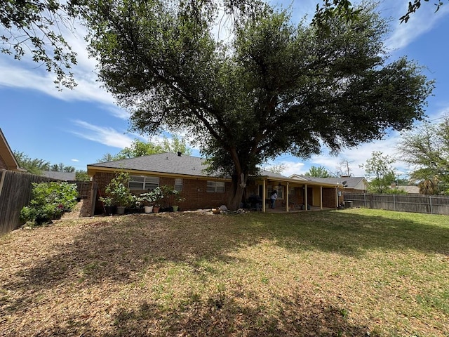 2408 Camarie Ave, Midland, TX 79705 - back of property featuring brick siding