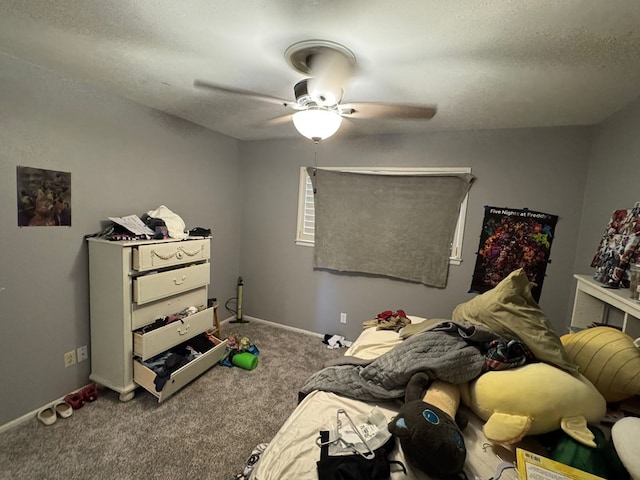 2408 Camarie Ave, Midland, TX 79705 - carpeted bedroom featuring a textured ceiling, a ceiling fan, and baseboards