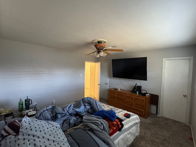 2408 Camarie Ave, Midland, TX 79705 - bedroom featuring carpet and a ceiling fan