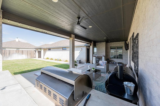 view of patio featuring an outdoor kitchen and a ceiling fan