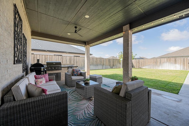 view of patio / terrace with outdoor lounge area, a grill, and an outdoor kitchen