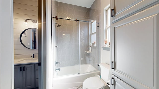 full bathroom featuring bathtub / shower combination, vanity, and toilet