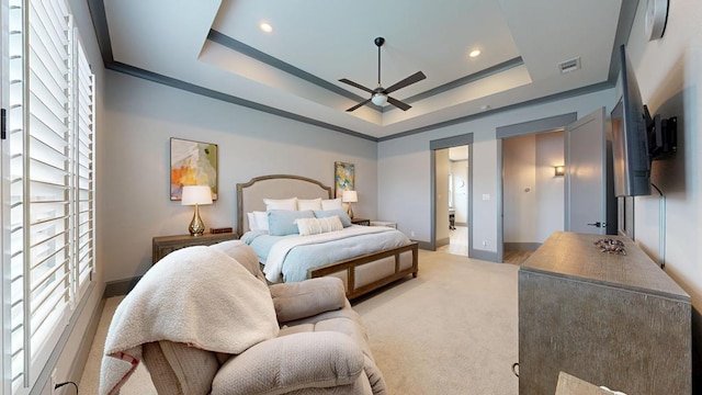 carpeted bedroom featuring a tray ceiling, baseboards, recessed lighting, and ceiling fan