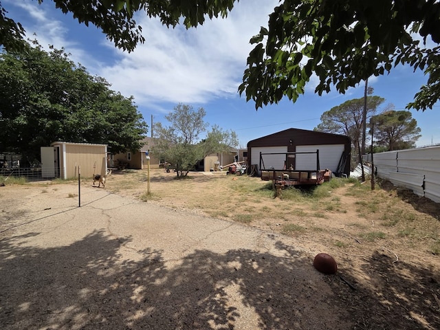 6208 E County Rd 84, Midland, TX 79706 - view of yard with a detached garage
