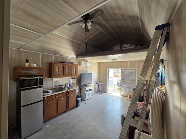 6208 E County Rd 84, Midland, TX 79706 - kitchen with wooden walls, wooden ceiling, light countertops, vaulted ceiling, and ceiling fan