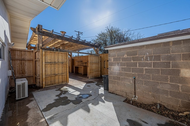 view of patio with a gate and fence