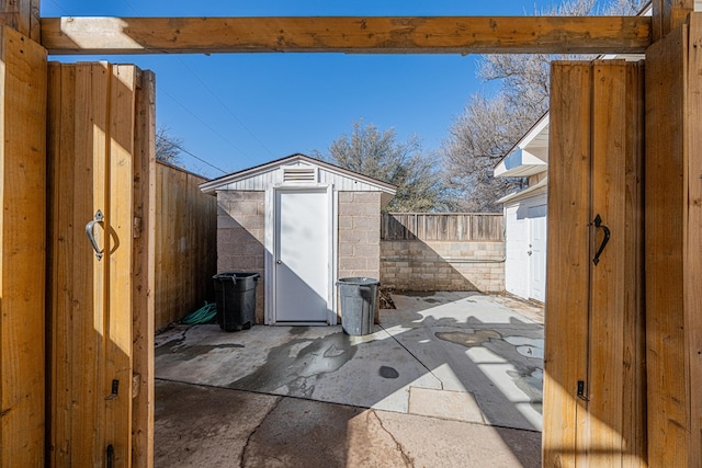 view of shed with a fenced backyard