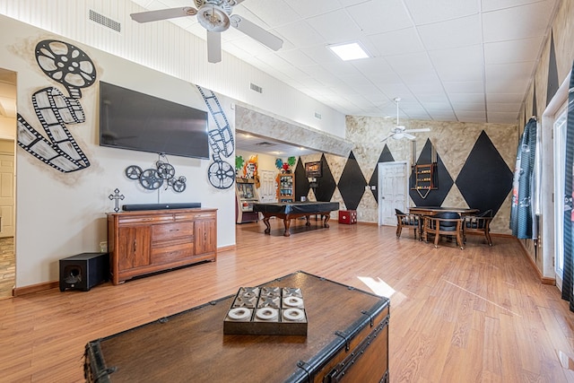 living area with billiards, visible vents, wood finished floors, a ceiling fan, and baseboards