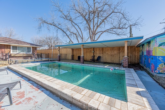 view of swimming pool featuring a fenced in pool, a patio area, and a fenced backyard