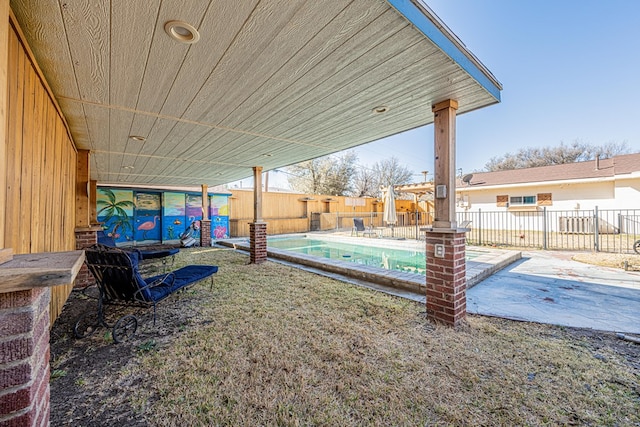 view of yard with a patio area, a fenced backyard, and a fenced in pool