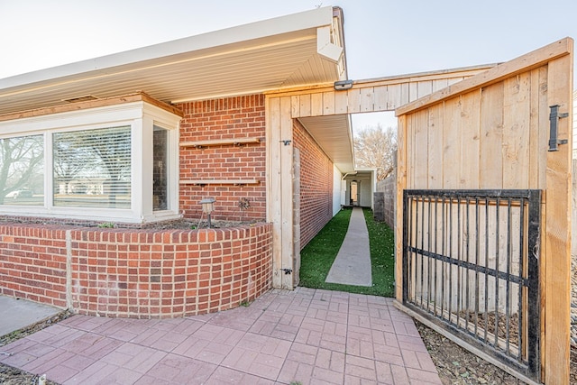 property entrance with brick siding