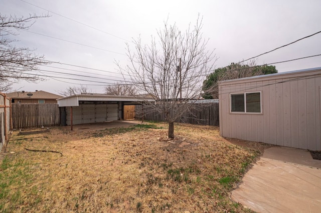 view of yard with a fenced backyard and an outdoor structure