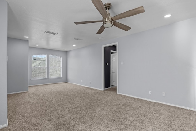 carpeted empty room featuring a textured ceiling and ceiling fan