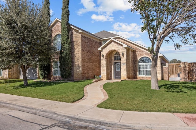 view of property featuring a front lawn