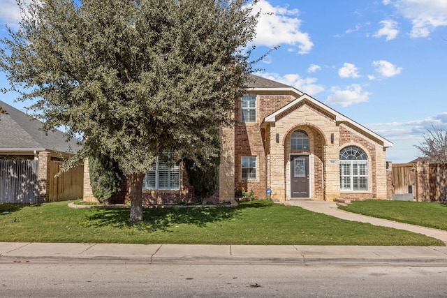 view of property featuring a front yard