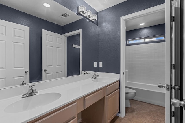 full bathroom featuring vanity,  shower combination, tile patterned floors, and toilet