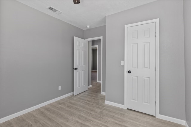 1344 E 5th St, Odessa, TX 79761 - unfurnished bedroom with baseboards and light wood-type flooring