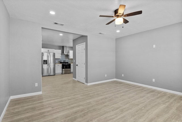 1344 E 5th St, Odessa, TX 79761 - unfurnished living room with ceiling fan, light wood-style floors, baseboards, and recessed lighting