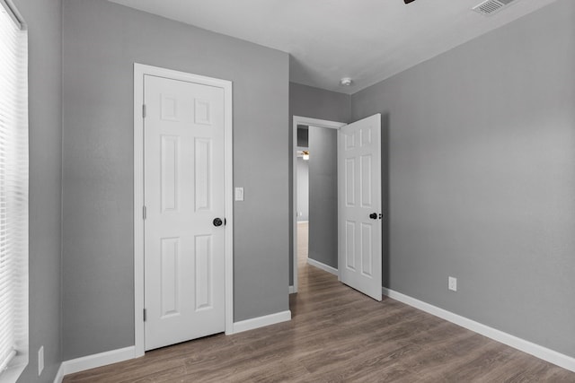1344 E 5th St, Odessa, TX 79761 - unfurnished bedroom featuring baseboards and wood finished floors