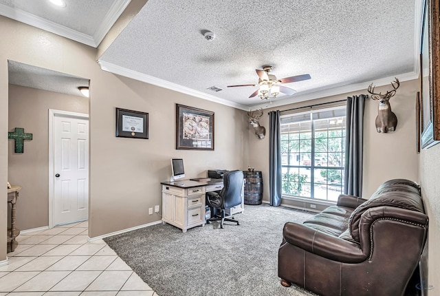 office space with ornamental molding, a ceiling fan, baseboards, a textured ceiling, and light tile patterned floors