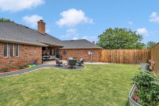 view of yard featuring a patio area and a fire pit