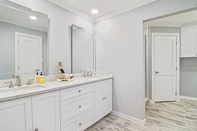 bathroom with vanity, wood-type flooring, and crown molding