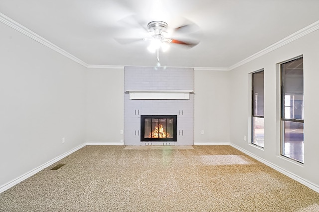 unfurnished living room with ceiling fan, ornamental molding, a fireplace, and carpet floors