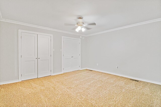 unfurnished bedroom with carpet, ceiling fan, and ornamental molding