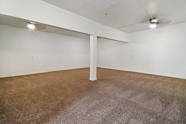 basement featuring dark colored carpet