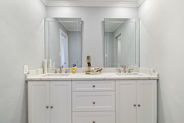 bathroom with vanity and ornamental molding