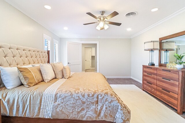 bedroom with ceiling fan, crown molding, and dark carpet