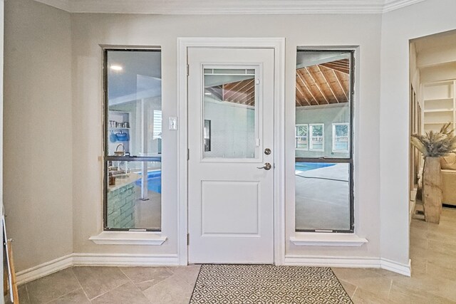 doorway to outside with light tile patterned floors