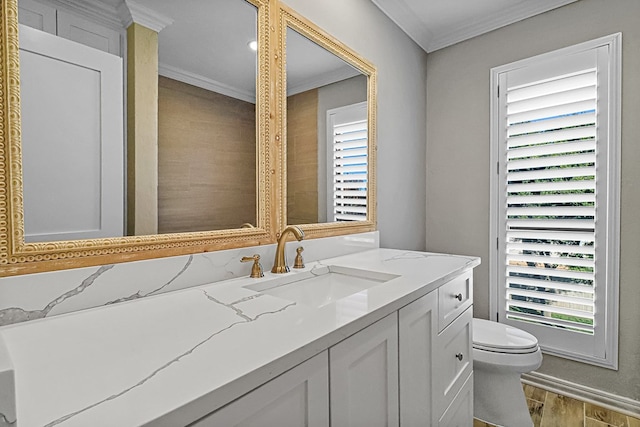 bathroom with hardwood / wood-style floors, vanity, and ornamental molding