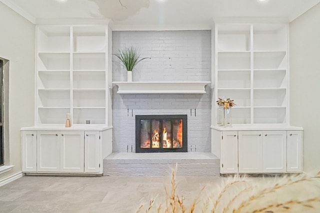 unfurnished living room featuring a brick fireplace