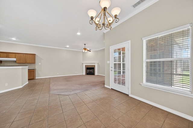 29 Vista Crest Ct, Odessa, TX 79762 - unfurnished living room featuring light tile patterned floors, crown molding, a ceiling fan, a chandelier, and plenty of natural light