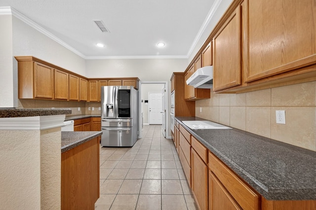 29 Vista Crest Ct, Odessa, TX 79762 - kitchen with white appliances, under cabinet range hood, decorative backsplash, ornamental molding, and light tile patterned floors